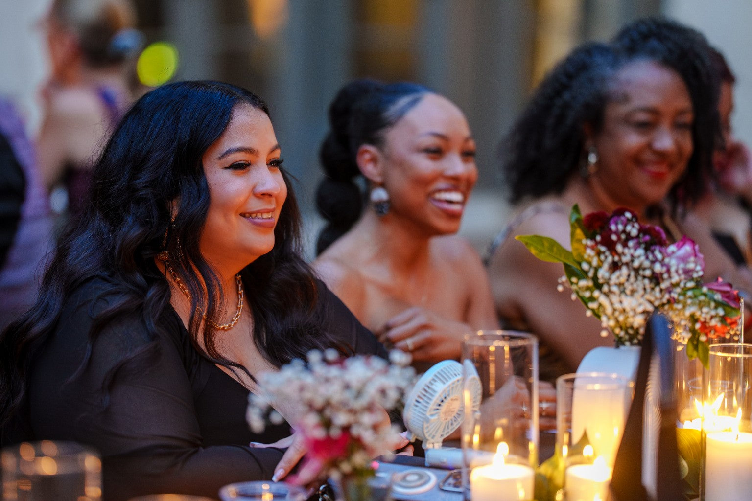 Guests laughing around a table