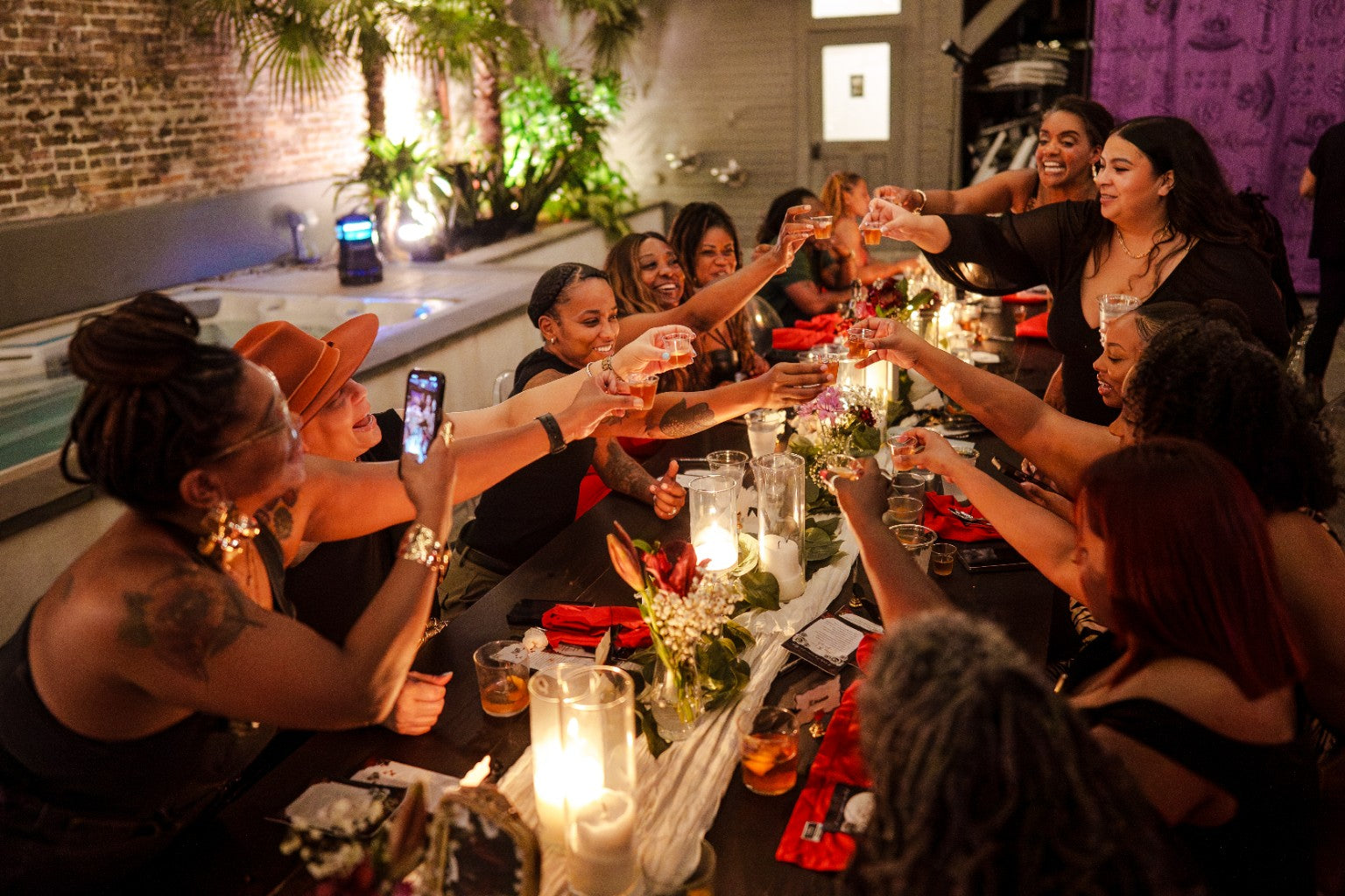 Guests sharing a candlelit dinner
