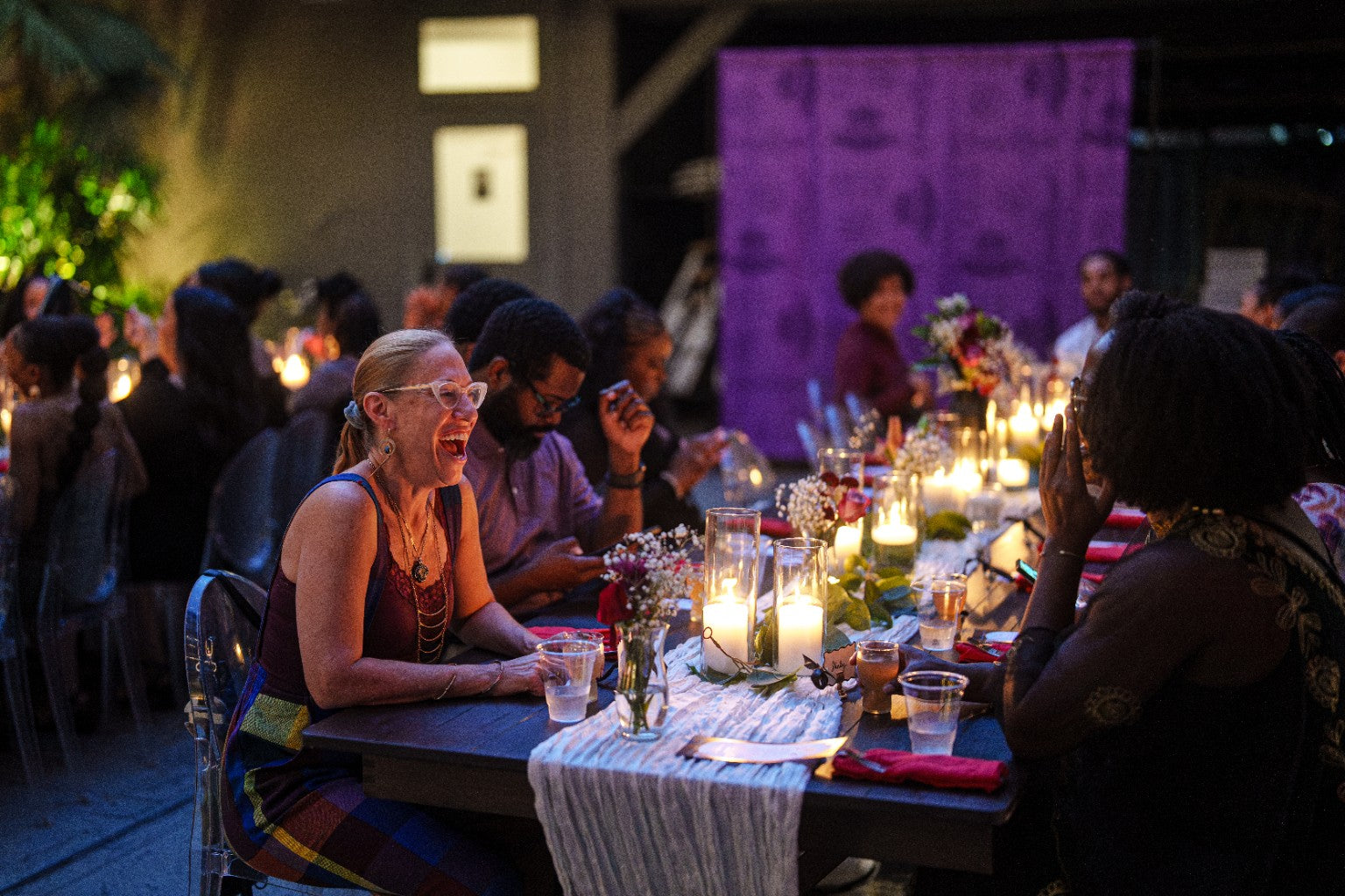 A long candlelit dinner table